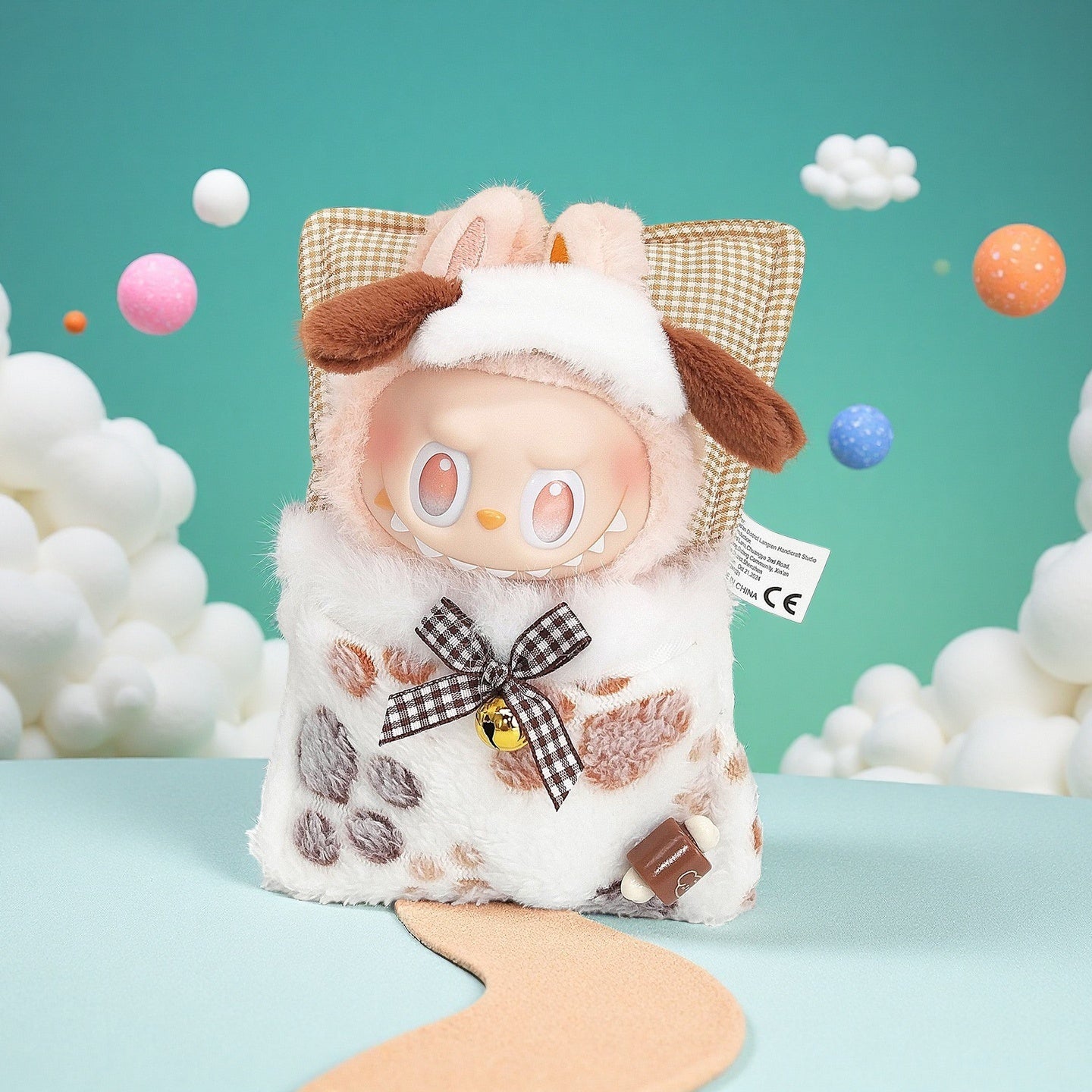 The ZoDoll Labubu Cow Plush Costume Set features a plush toy with a gingham hood, animal ears, and a gold bell—an adorable addition to any Pop Mart accessory collection.