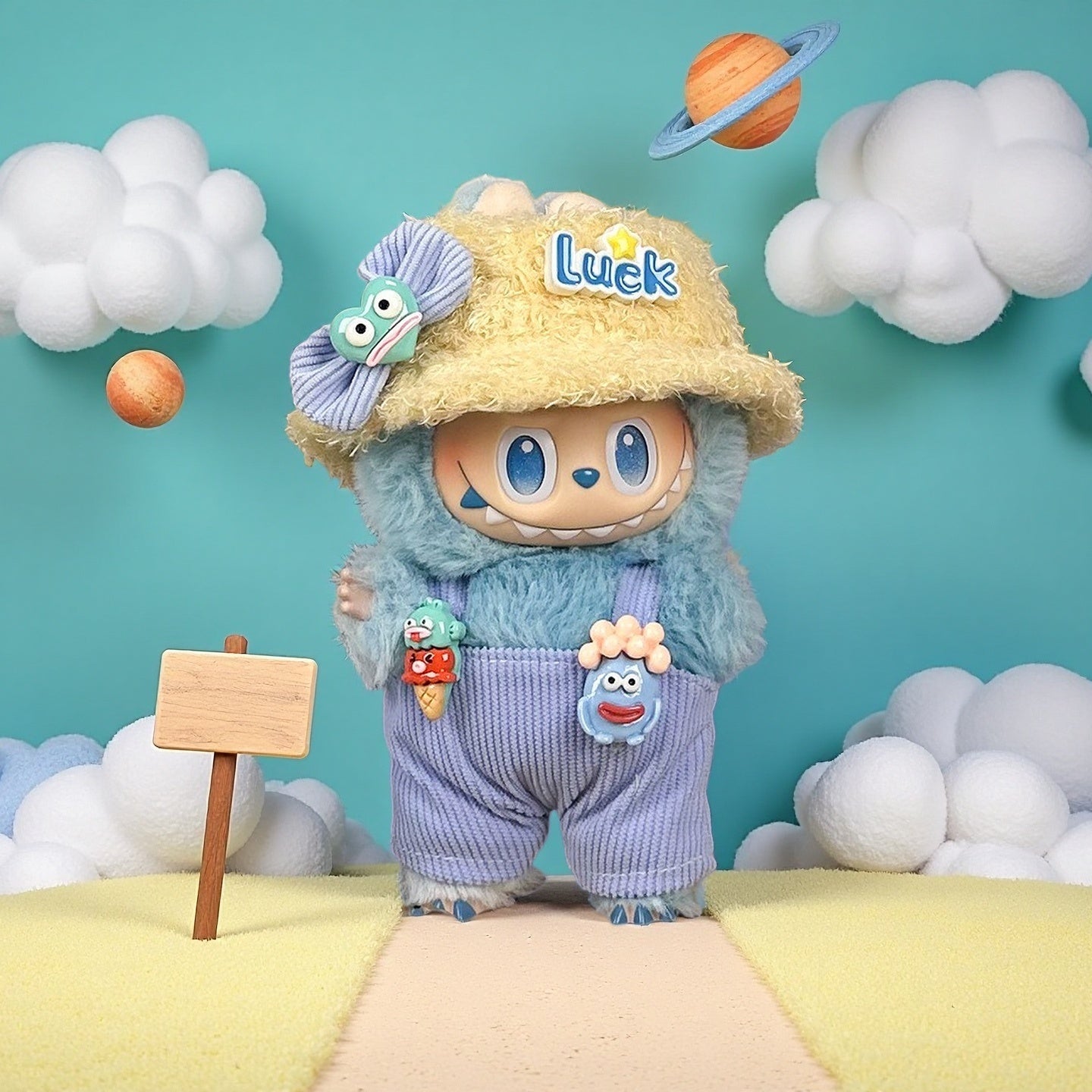 The ZoDoll Labubu Doll Lavender Corduroy Overalls and Luck Bucket Hat Outfit Set features a plush toy on a pastel path with clouds, a wooden sign, and planet, perfect for fans of Labubu doll outfits and Pop Mart Labubu accessories.