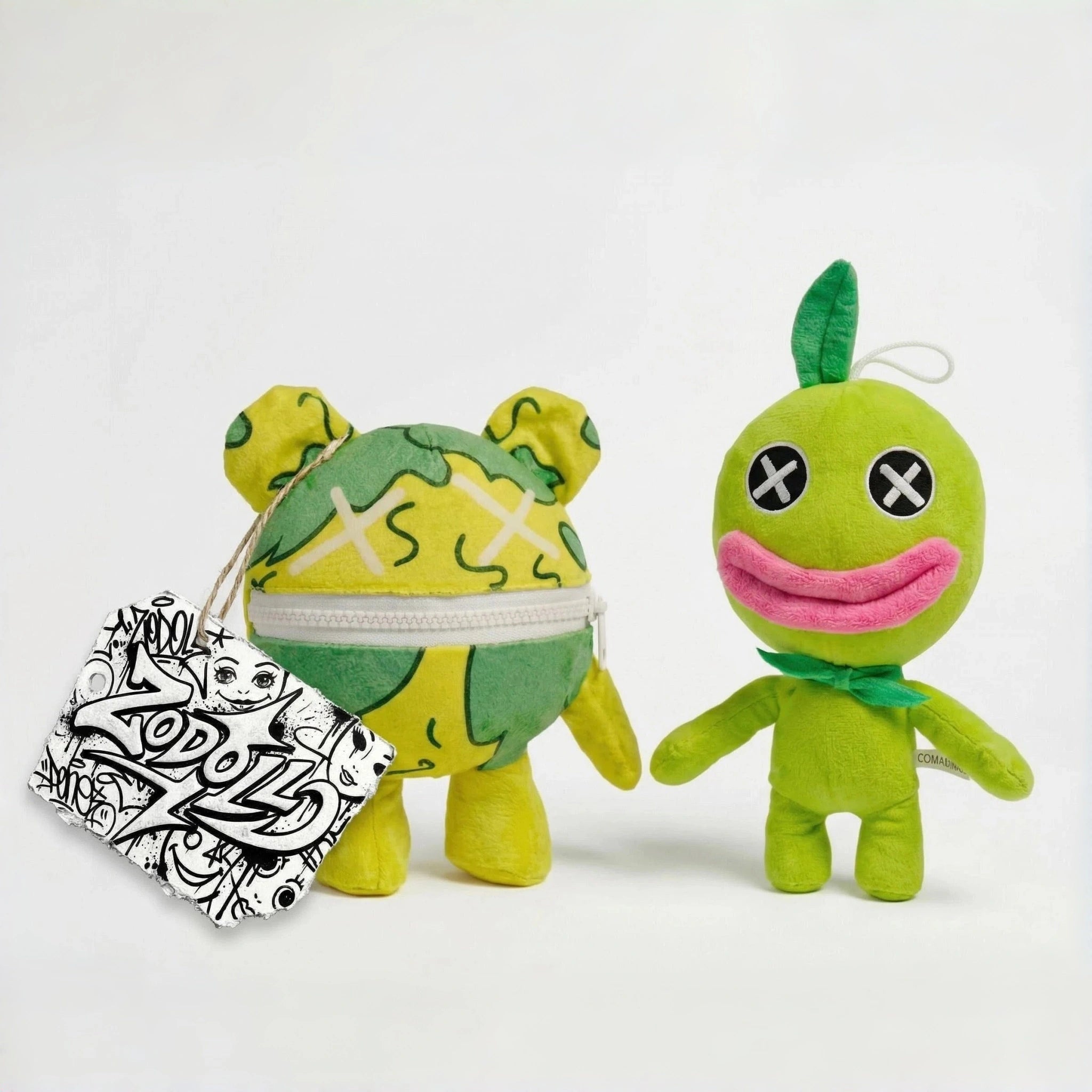 Two green ZoDoll Poppy Playtime Chapter 5 Wrongside Outimals Reversible Plush toys stand side by side; one shows its 2-in-1 ball to beast transformation with a zippered mouth and holds a black-and-white illustrated tag.