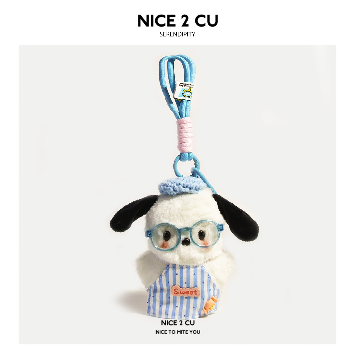 Kawaii plush dog charm in blue striped apron with Sweet patch, blue round glasses, and blue-pink braided loop cord