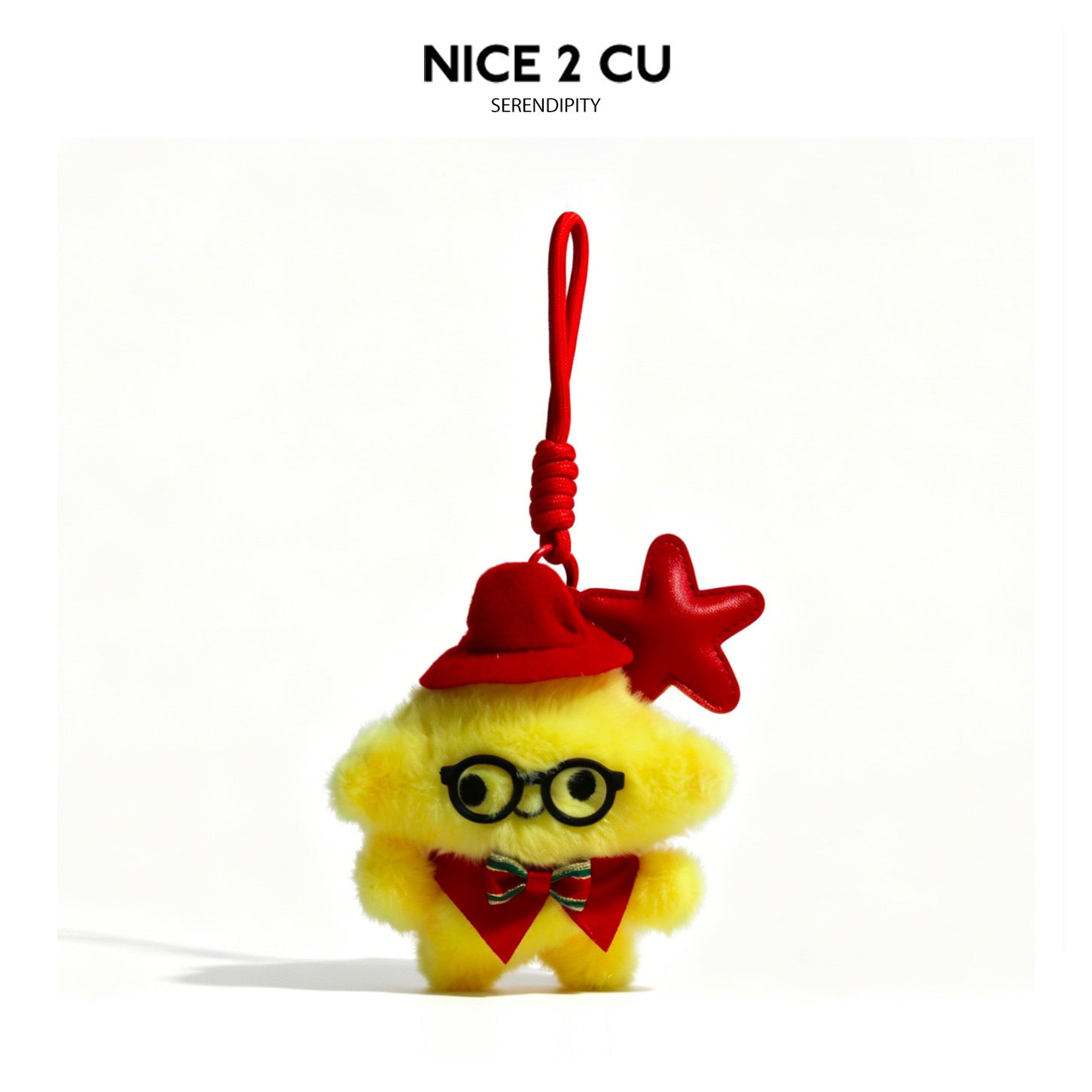 Yellow fluffy witch plush charm with red hat, red bow, and red star accent on hanging cord loop