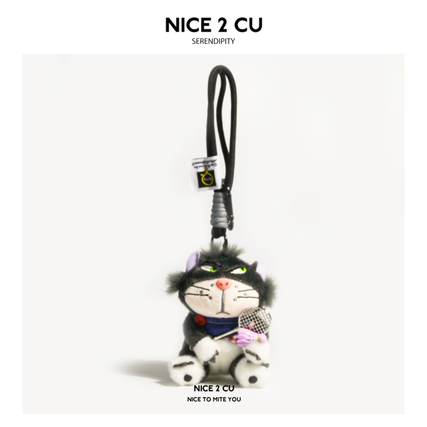 Fluffy black cat plush charm with green eyes, navy bow tie, and miniature badminton racket and shuttlecock on a loop strap