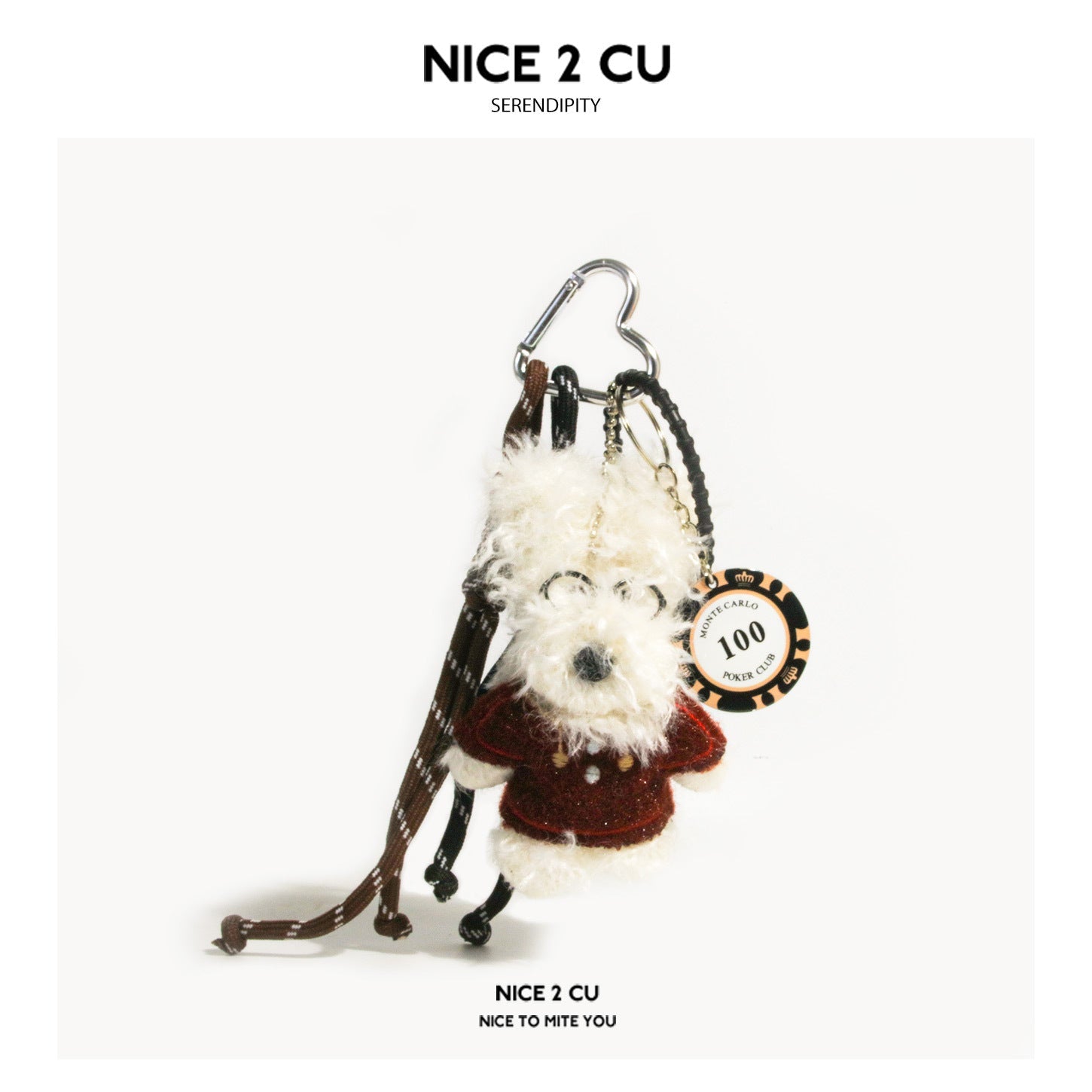 White curly-fur dog plush charm wearing a red velvet-style top, with metal carabiner clip and Monte Carlo poker chip hang tag