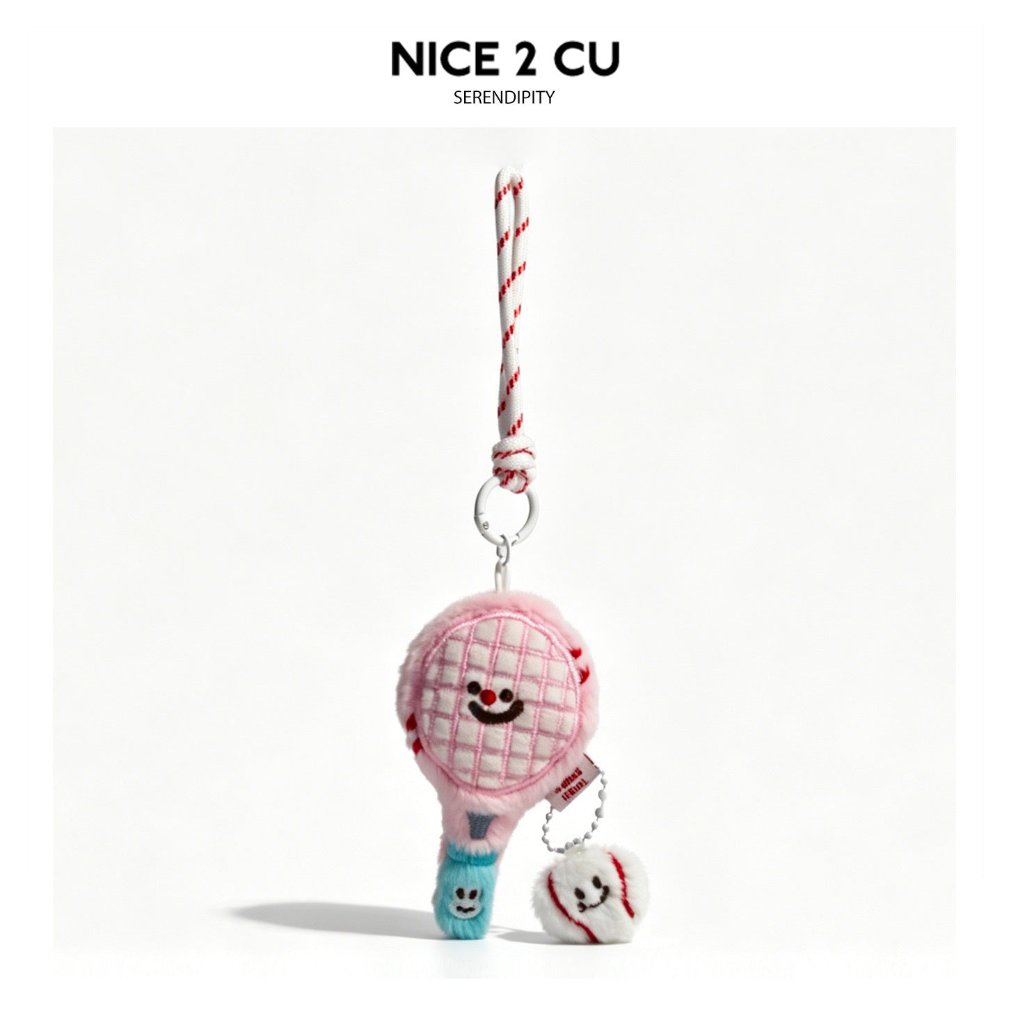 Pink kawaii tennis racket plush charm keychain with smiling face and small white tennis ball charm attached by a short chain