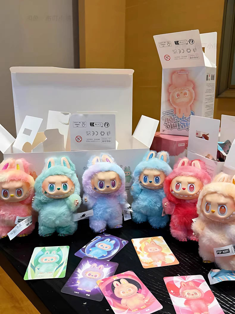 Six vibrant Labubu plush keychains—Love, Happiness, Loyalty, Serenity, Hope & Luck—are displayed with matching cards and boxes. The POP MART “Big Into Energy” set is perfect for collectible plush fans.