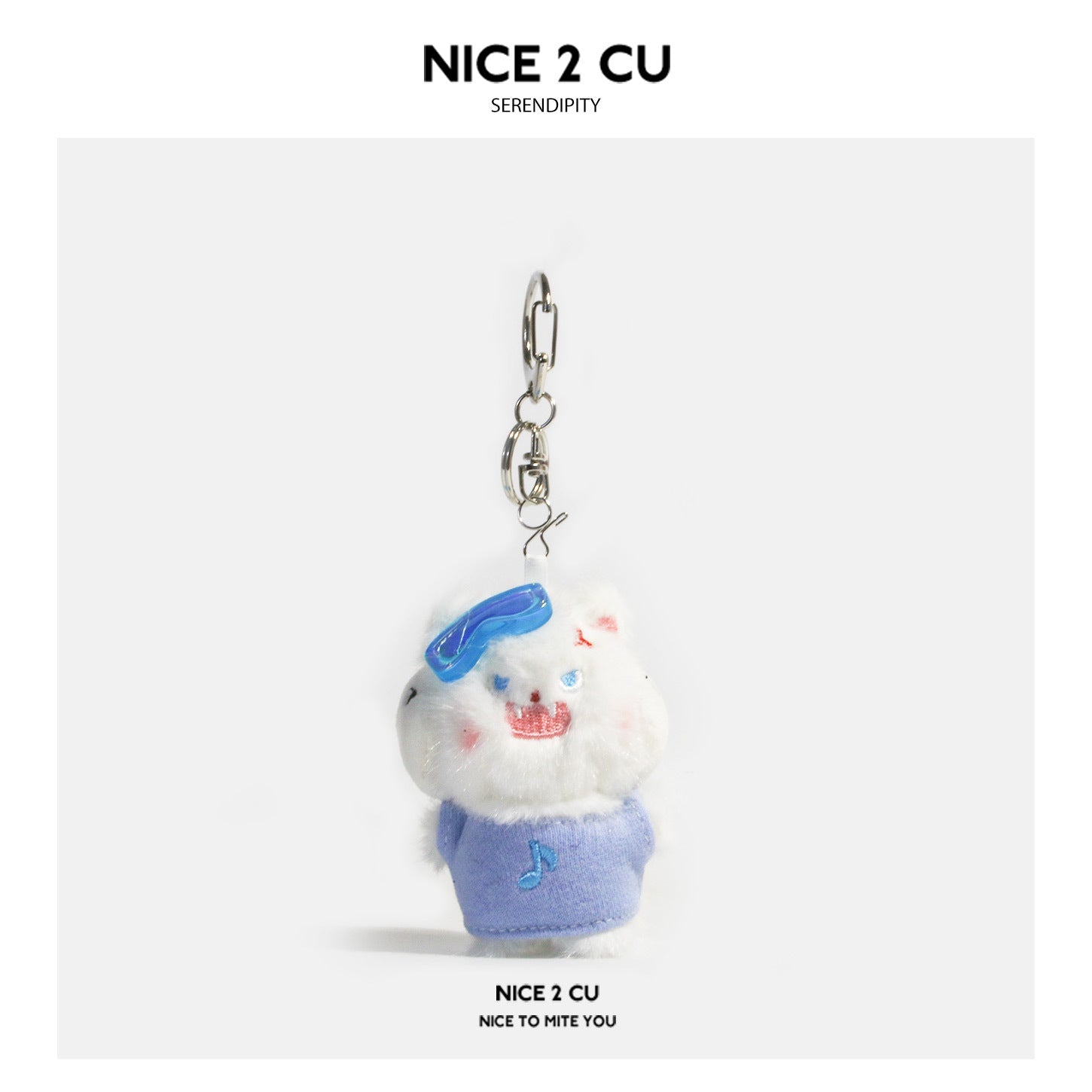 White fluffy plush cat keychain charm wearing blue wireless earphones and a light blue shirt with a musical note, silver clas