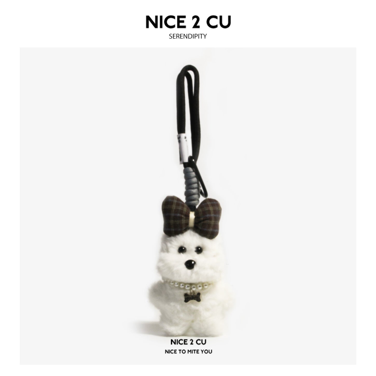 White fluffy plush dog bag charm with plaid bow, pearl necklace with bow charm, and black loop strap