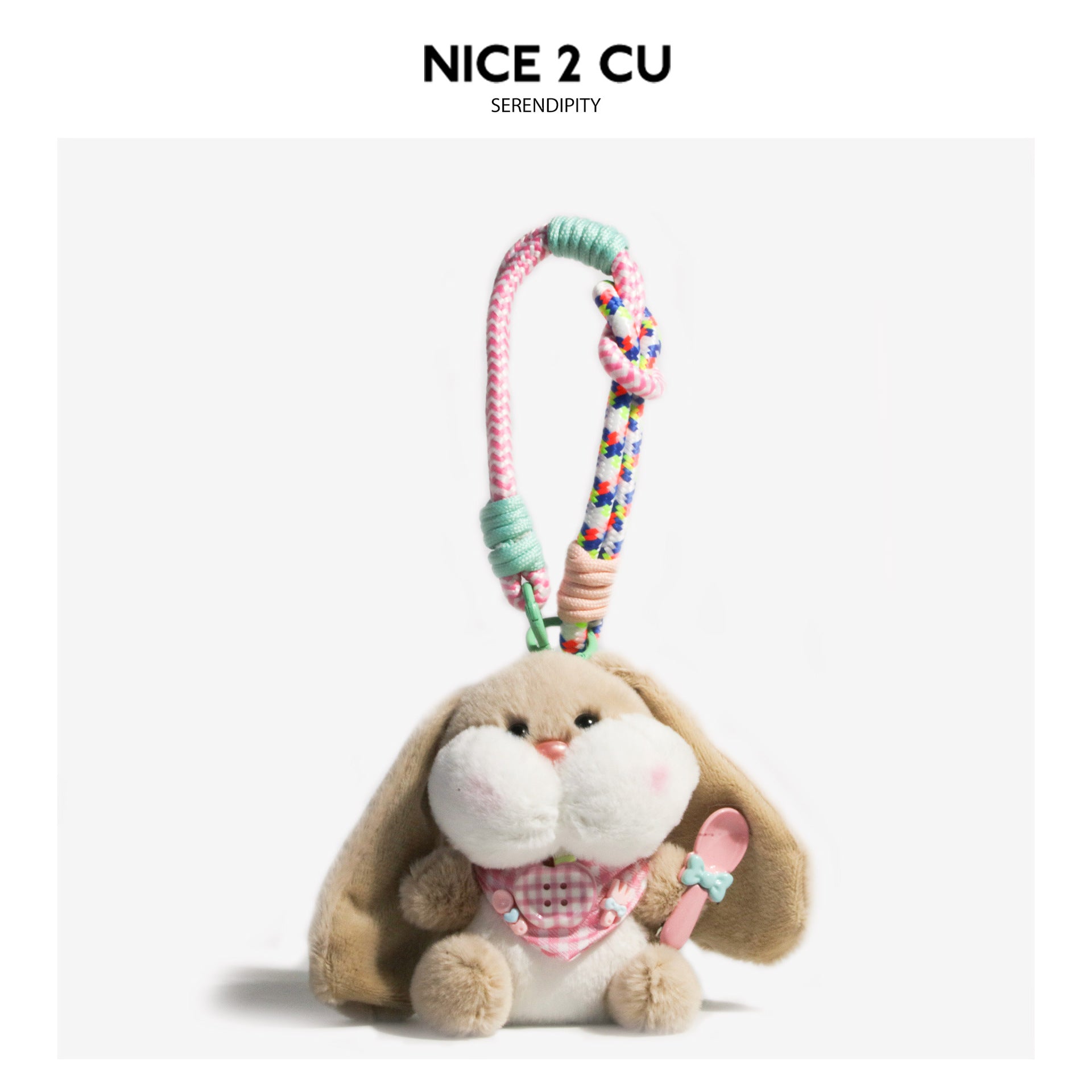 Light brown floppy-ear bunny plush charm with white puffy face, pink gingham bib, and braided cord clip