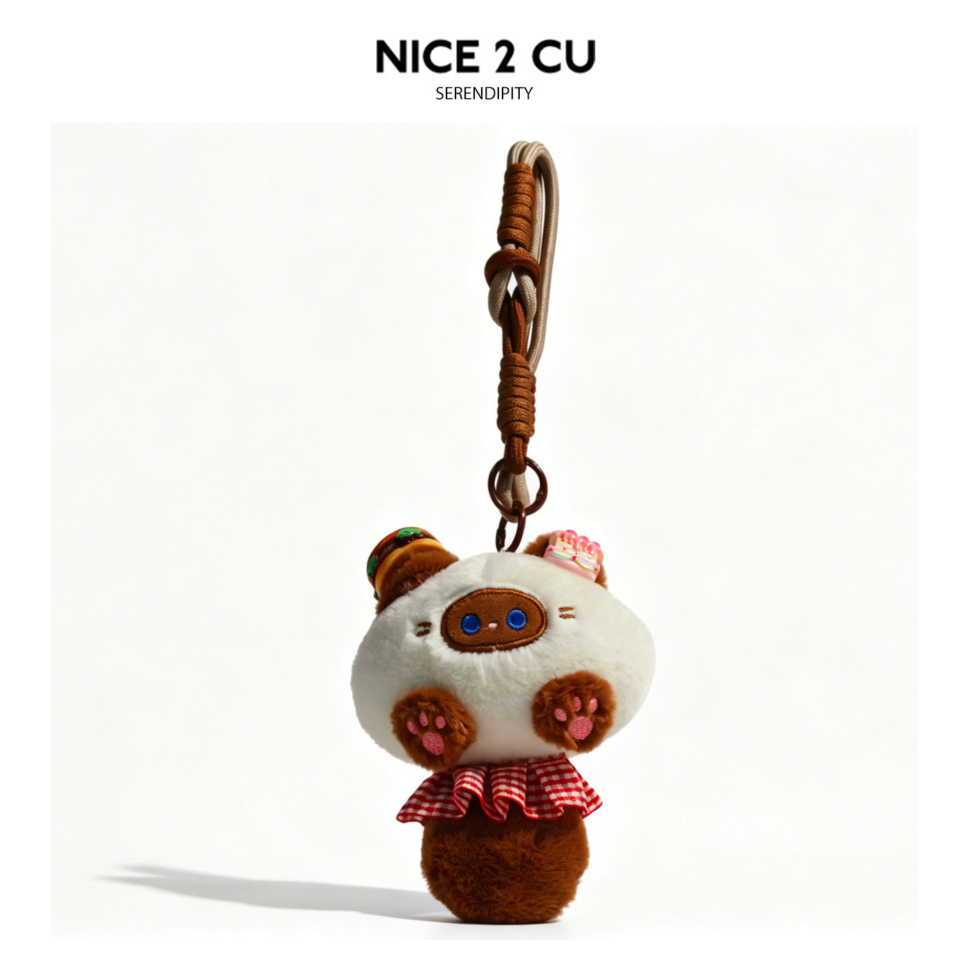 Brown and white plush cat charm with red checkered skirt and brown clip strap