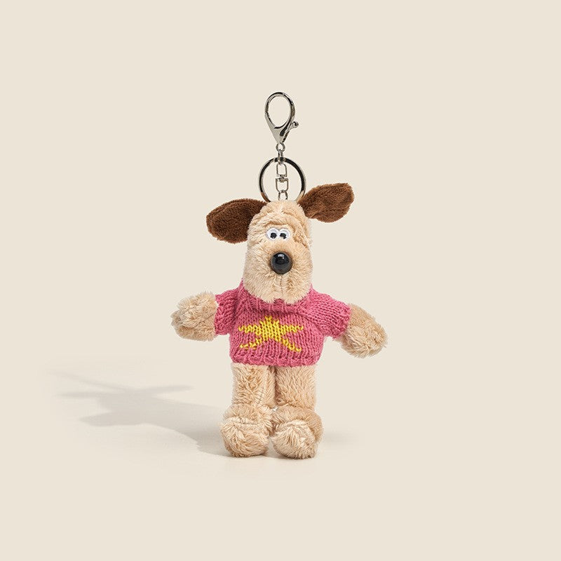 Long-fur cream dog plush charm wearing rose-red knitted sweater with yellow star
