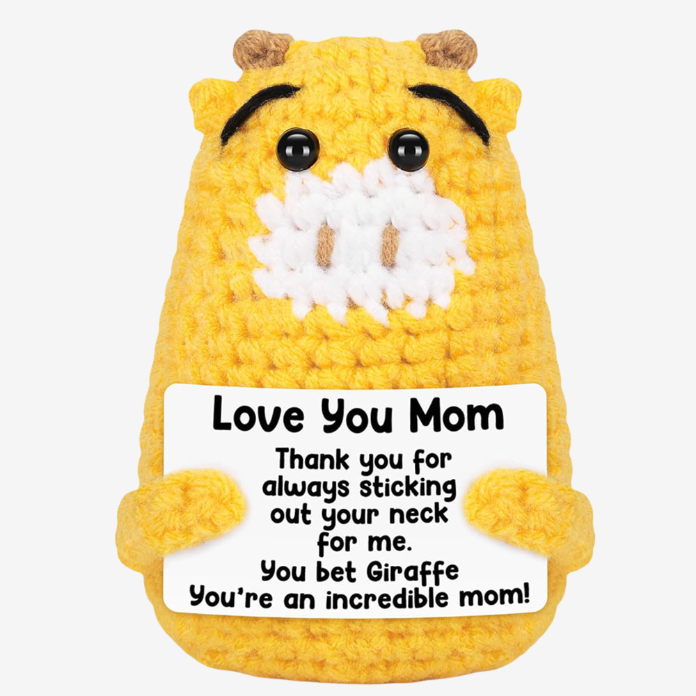 The ZoDoll Love You Mom Crochet Giraffe holds a “Love You Mom” sign—a heartfelt thank you gift for incredible mothers and the perfect handmade Mother’s Day or mom gift.