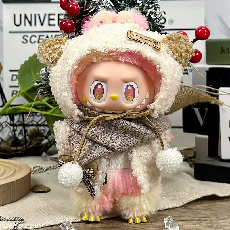 A ZoDoll Labubu Fluffy Bear Hoodie Coat Set with Knit Scarf in Cream White features a plush doll with pink hair, large round eyes, and yellow claws, standing on a table surrounded by Pop Mart Labubu accessories and decor.