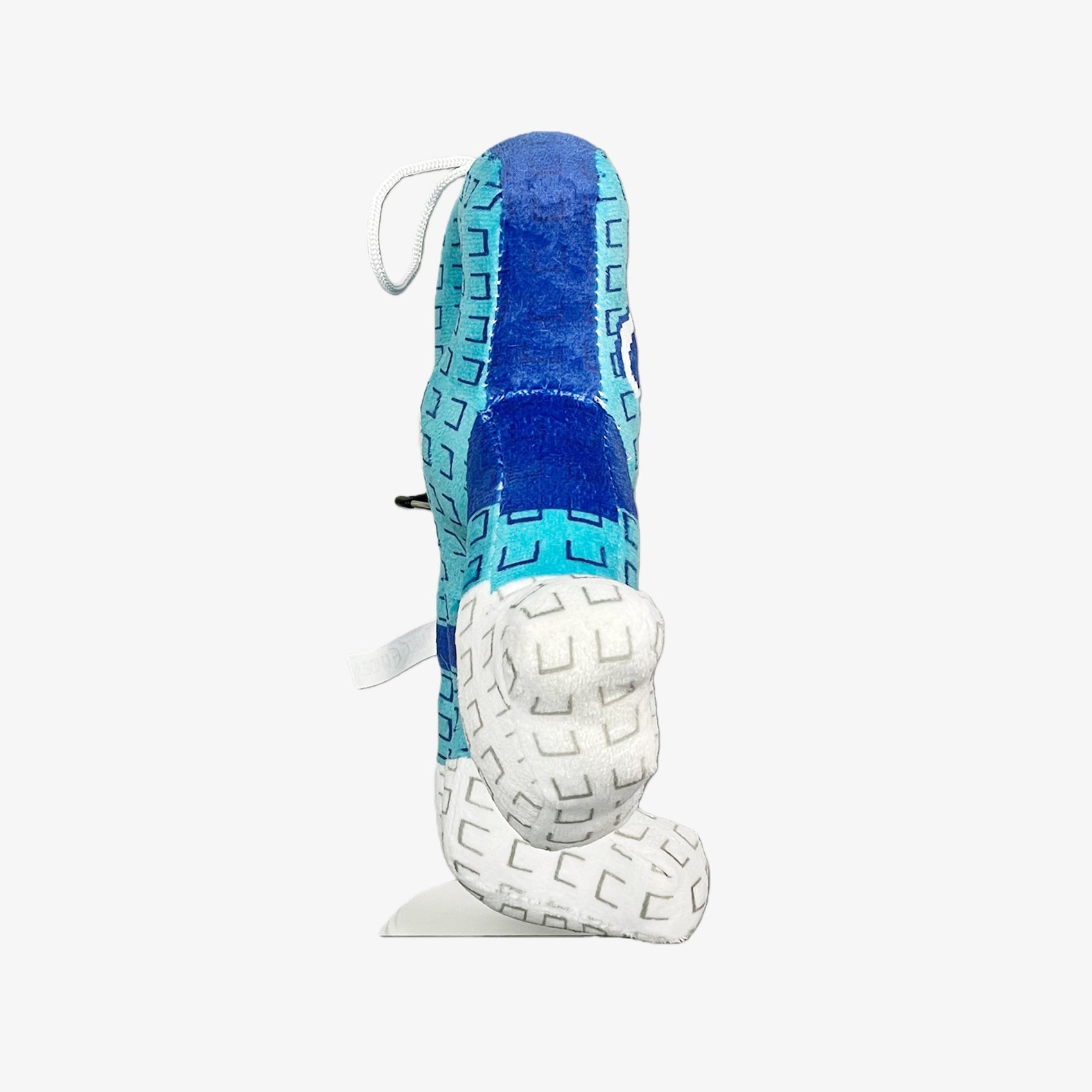 The Blue Brainrot Character Plush Toy by Steal a Brainrot stands upright, its teal and white abstract animal design and varied textured patterns making this 9.5” collectible plush an eye-catching art figure.