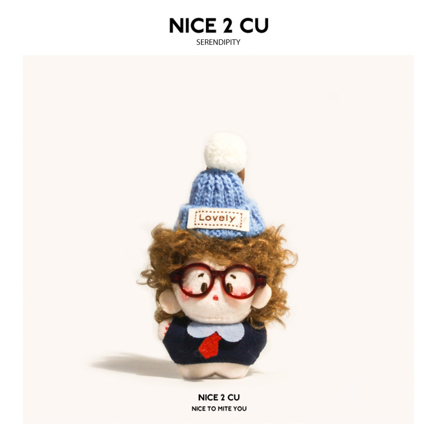 Chibi plush charm with brown curly hair, red glasses, and light blue knit pom-pom hat