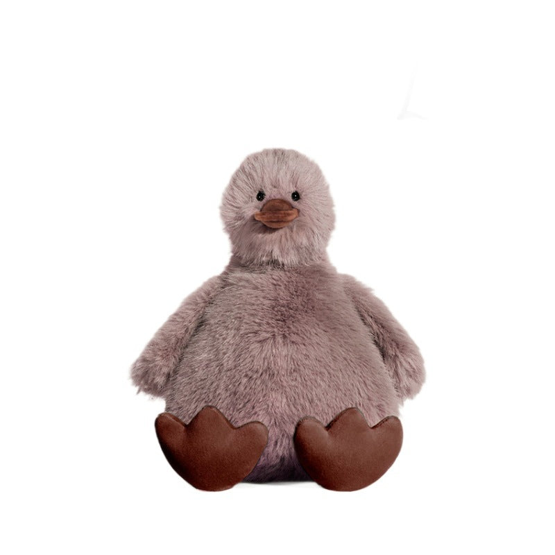 The JOOKI 20cm Fluffy Duck Plush Toy features soft brown and grey fur, a round body, and sits upright—making it perfect for kids, plush collectors, or as cute decor.
