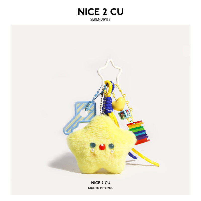 Yellow kawaii star plush bag charm with blue bead facial details, cloud hook clasp, rainbow disc charm, and colorful dangle a