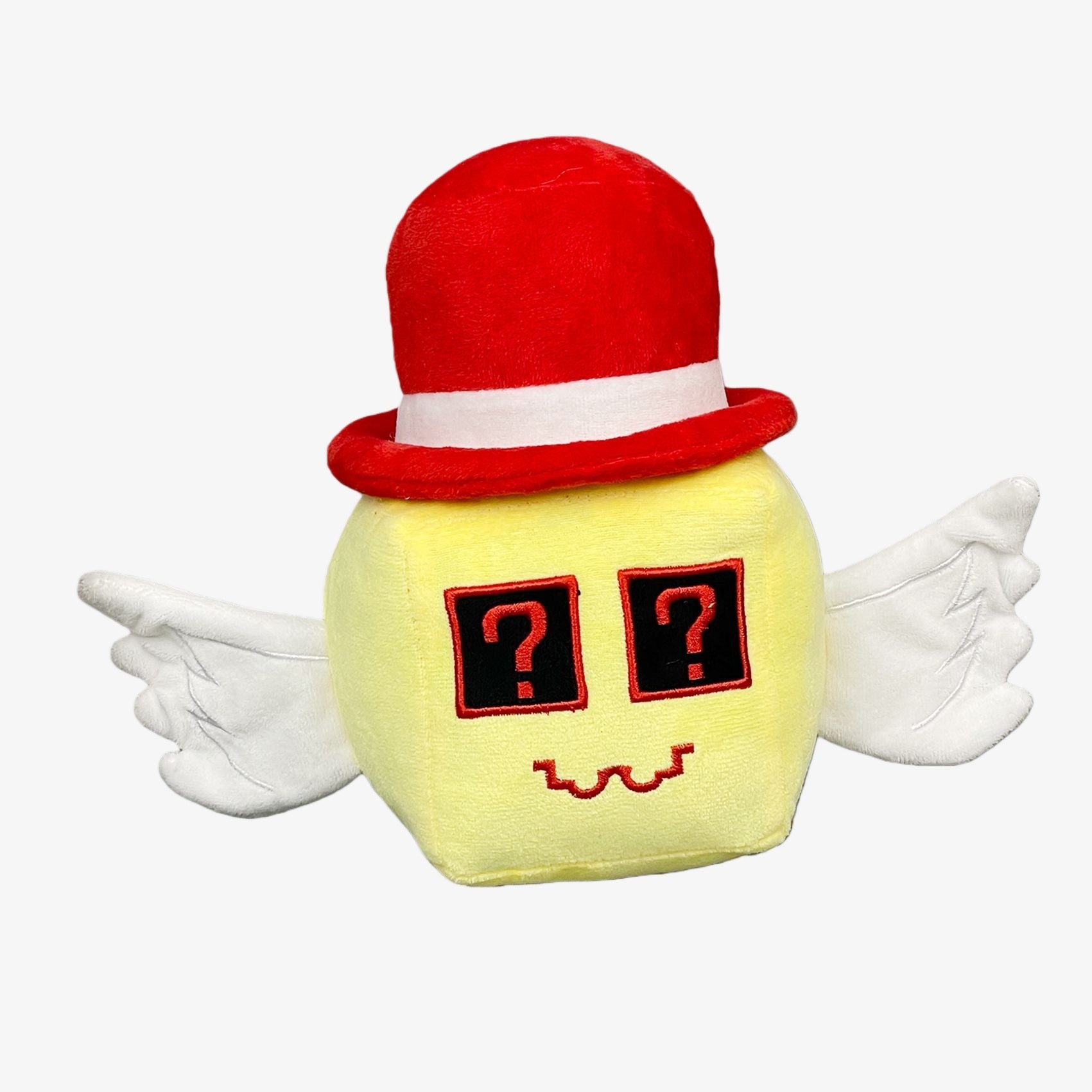 The Steal a Brainrot Mystery Angel Cube Plush Toy features a yellow square body, white wings, question mark eyes, and a red hat—an adorable 7.9-inch collectible plush perfect for fans of unique cartoon figures.