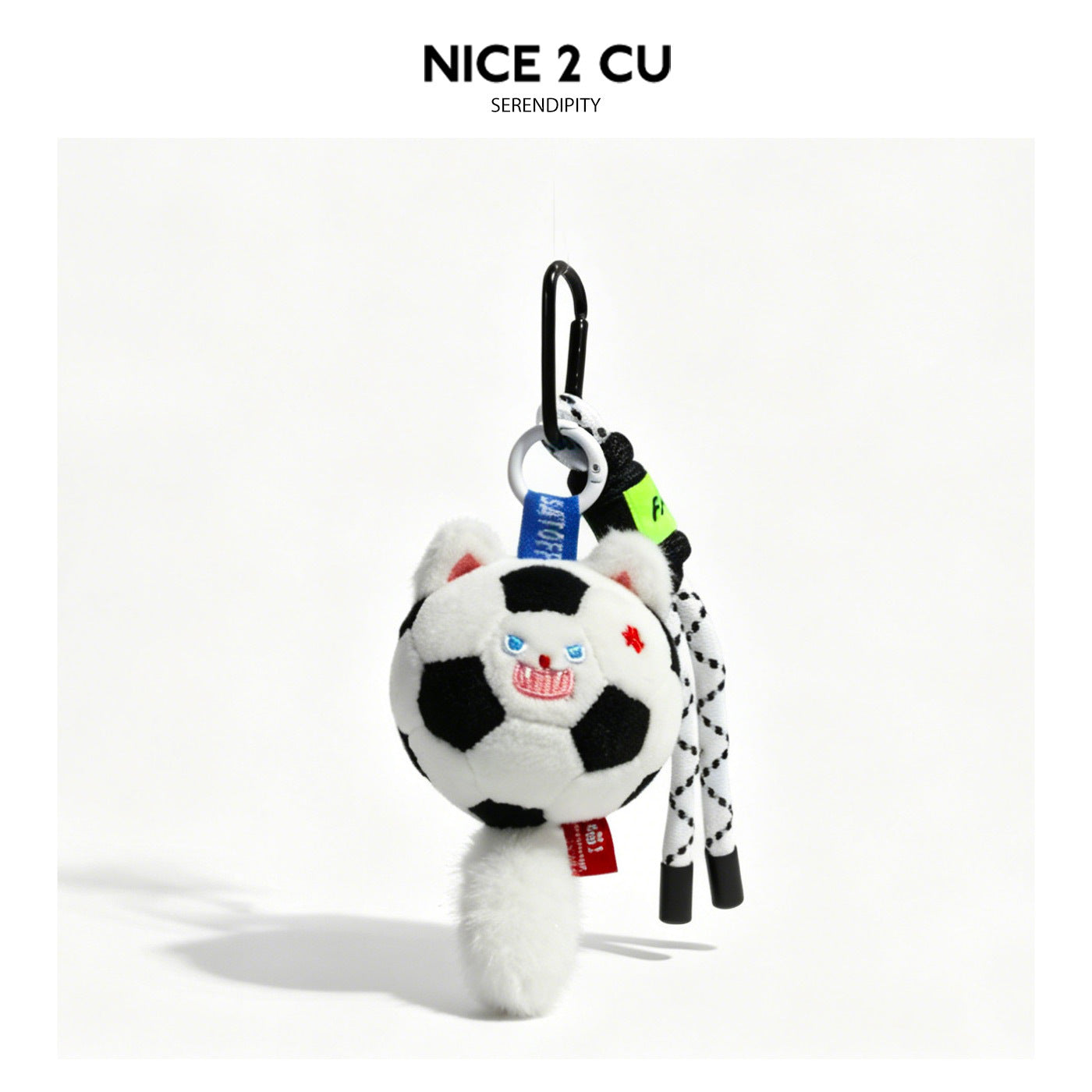 White standing plush cat keychain with soccer ball and extra patterned hanging cords
