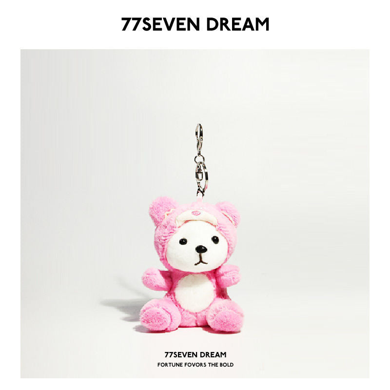 Bright pink plush bear keychain charm in a strawberry-bear hooded costume with white face