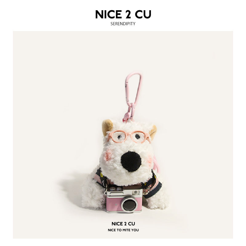 White Westie plush charm with pink glasses and pink-black sweater holding pink camera accessory, pink carabiner clip