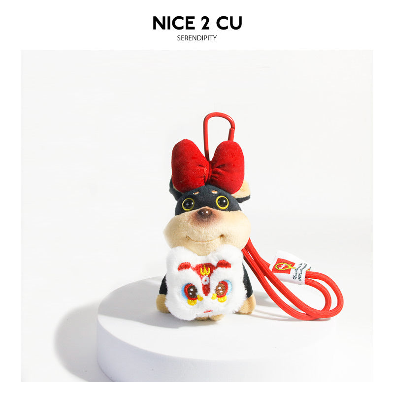 Beige plush dog keychain charm with large red bow and white lion dance face panel on red carabiner clip