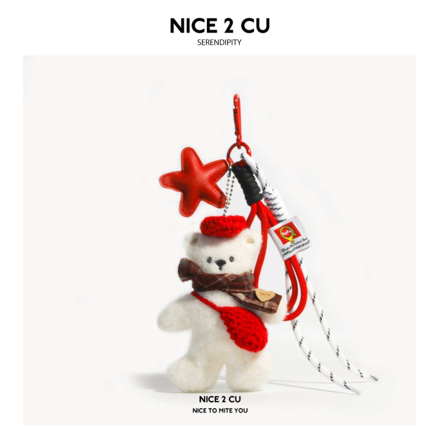 White plush teddy bear charm keychain with red knitted beret, brown plaid scarf, mini bag, and red star pendant