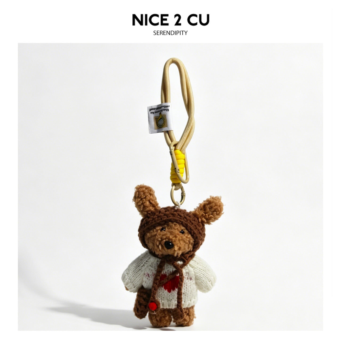 Bear plush bag charm in a white knitted sweater with a red heart motif, brown hood, and light braided cord loop