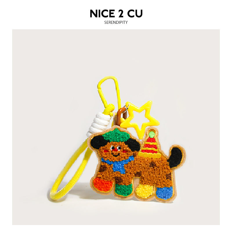 Embroidered brown dog bag charm with rainbow multicolor accents, yellow star pendant, and yellow carabiner clip