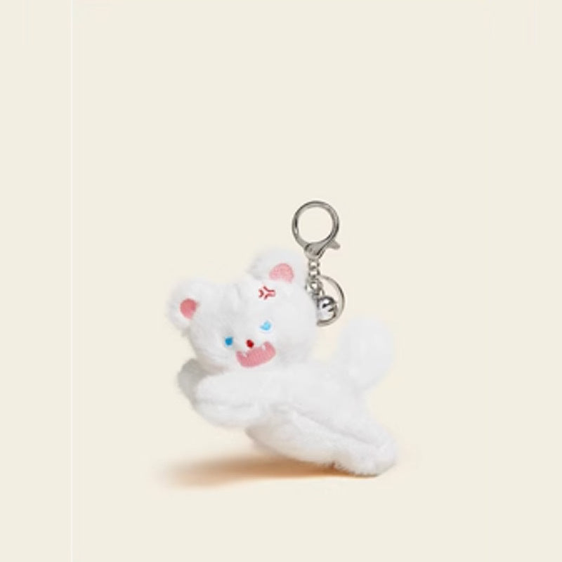White crouching kawaii cat plush keychain charm in a low stretched pose with blue eyes and silver clasp