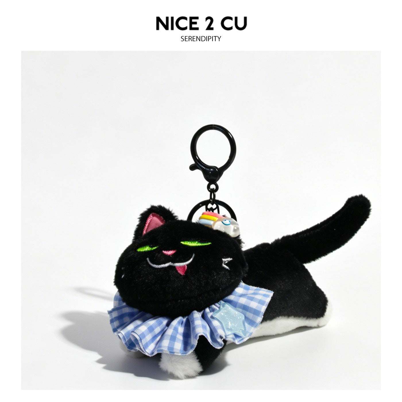 Black plush cat keychain charm in prone pose wearing a blue gingham ruffled collar with lobster-claw clasp and decorative min