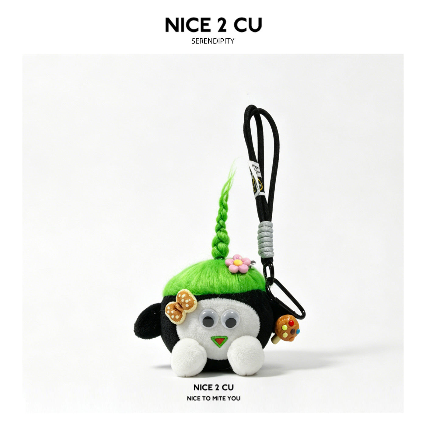 Black kawaii plush charm keychain with bright green braided top tuft, googly eyes, and bow accent on black hanging strap