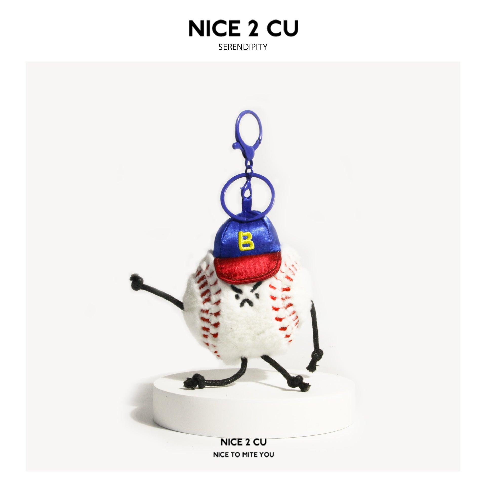 White tennis ball plush keychain charm with red seam stitching, embroidered face, black cord limbs, and blue-red cap