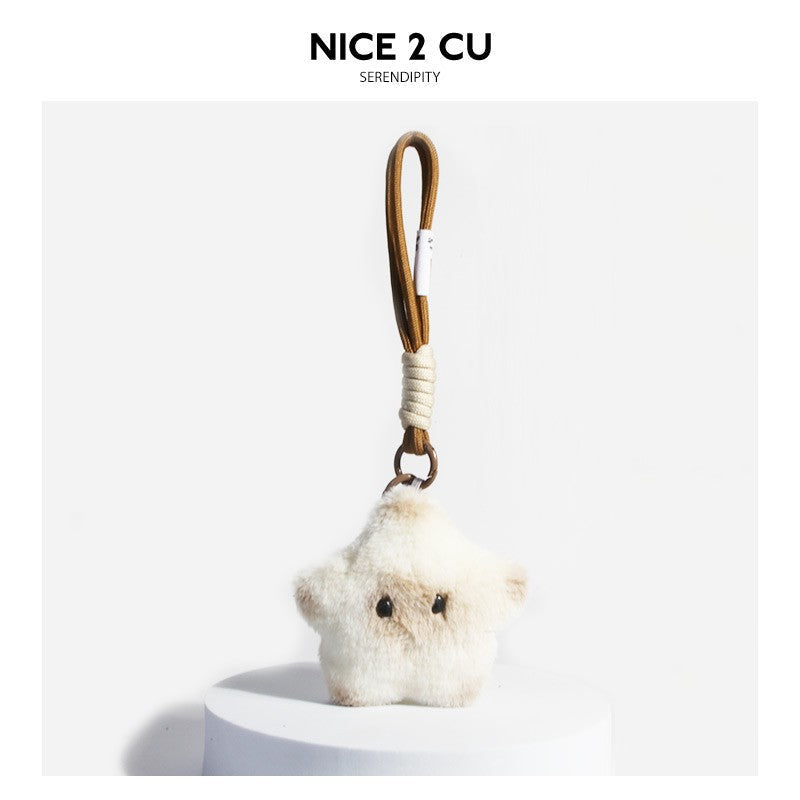 Minimalist cream-white star cat plush charm with brown braided cord and white woven strap detail