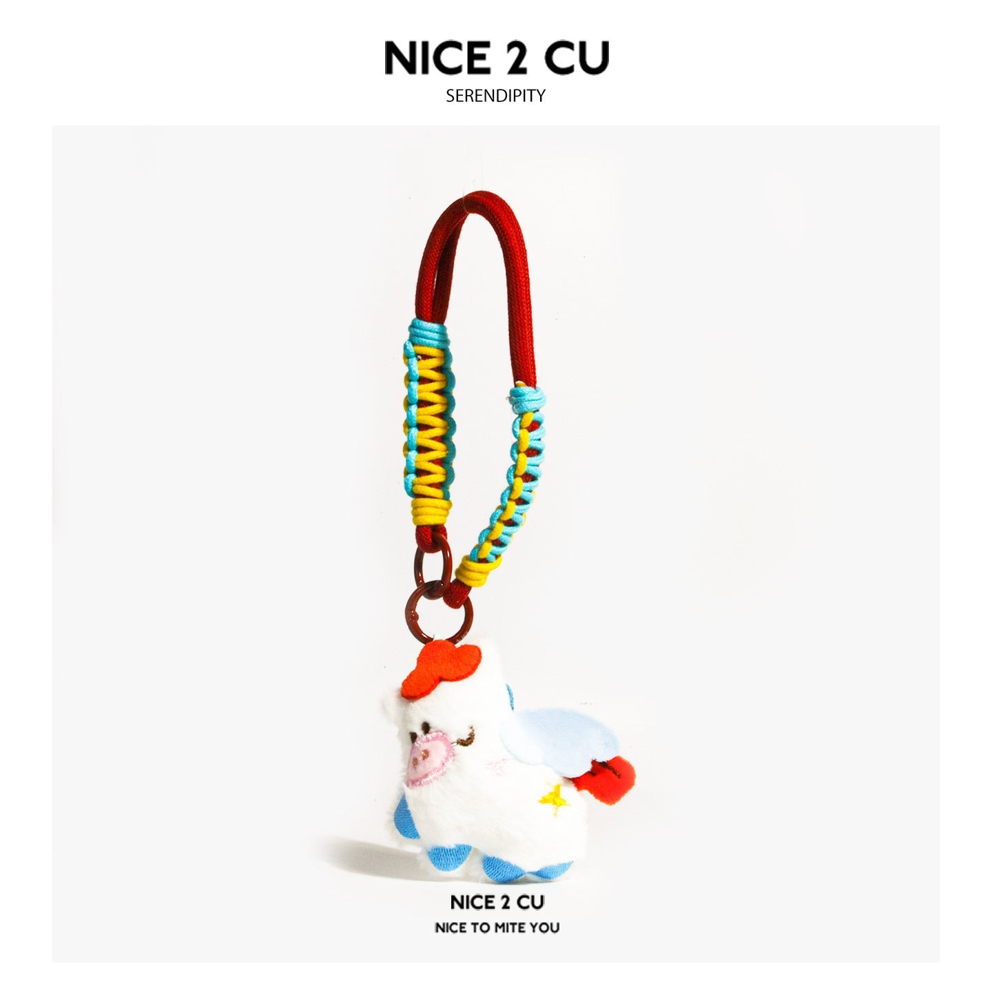 White plush animal charm with pale blue wings, pink snout, and red and blue-yellow braided hanging cord