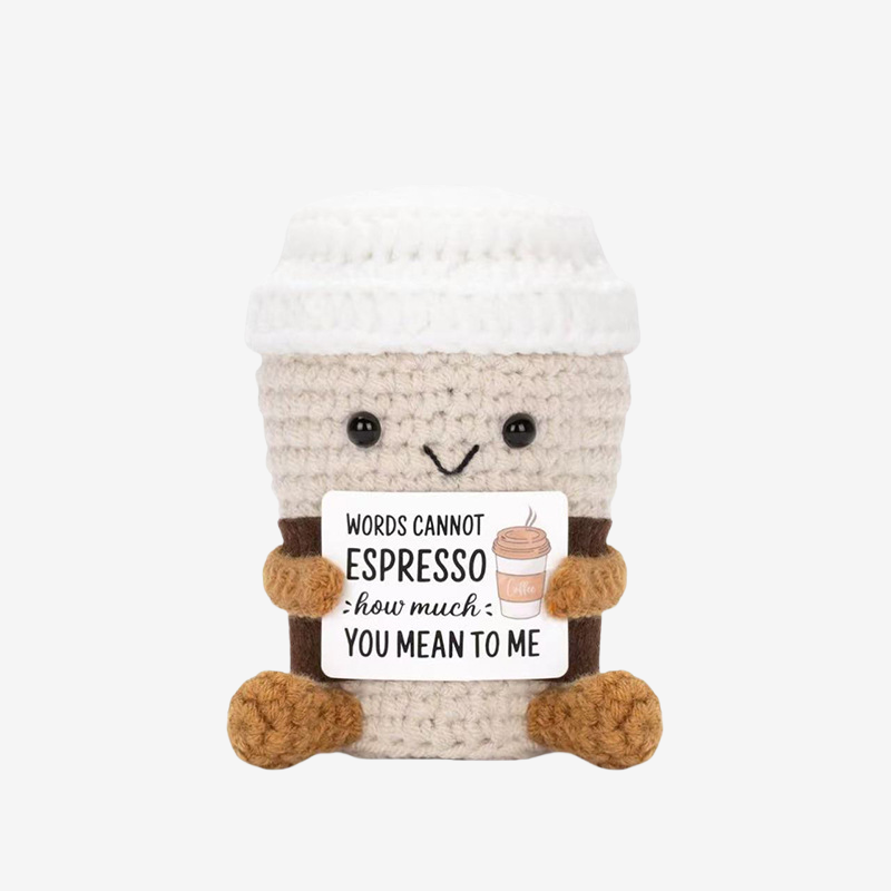 The ZoDoll Words Cannot Espresso Crochet Mug is a smiling coffee plush holding a sign that reads "Words cannot espresso how much you mean to me"—a perfect handmade gift for coffee lovers and special someones.