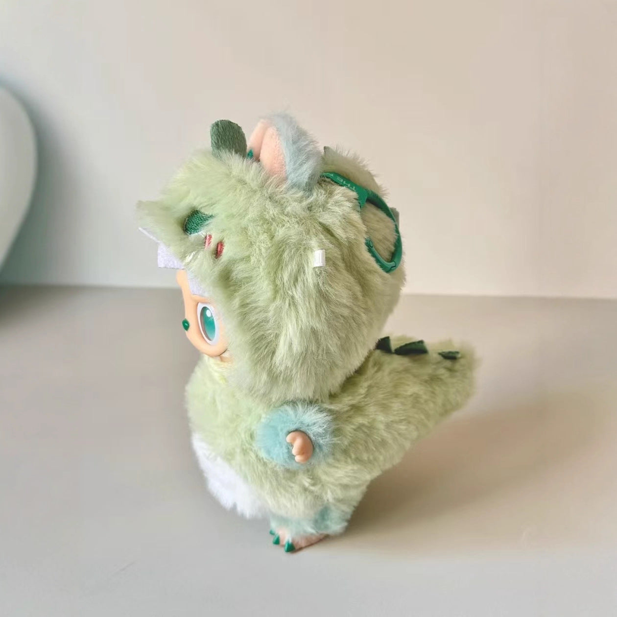 A ZoDoll Labubu Green Monster Bunny Plush Hoodie Doll Costume Outfit stands on a plain surface against a neutral background.