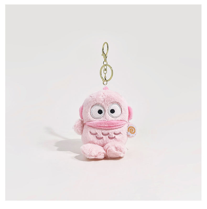 Pink chibi clownfish plush keychain charm with oversized cartoon eyes and gold metal clip attachment