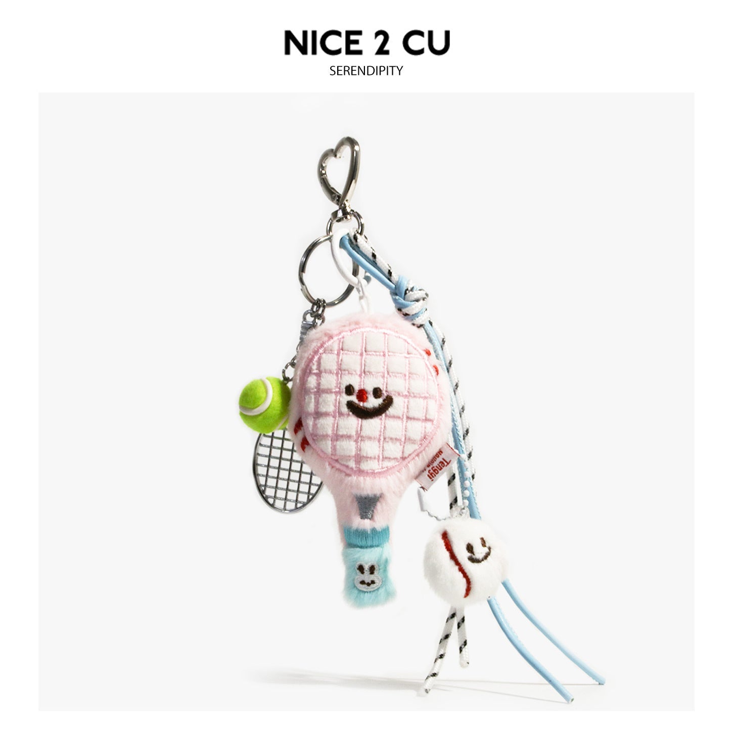 Pink kawaii tennis racket plush bag charm with smiley face, neon green accents, and decorative cord lanyard