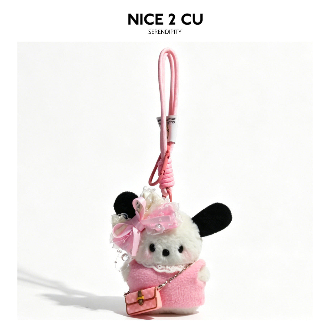 Plush dog bag charm in pink outfit with large pearl-accent decorative bow and pink miniature handbag on pink clip cord