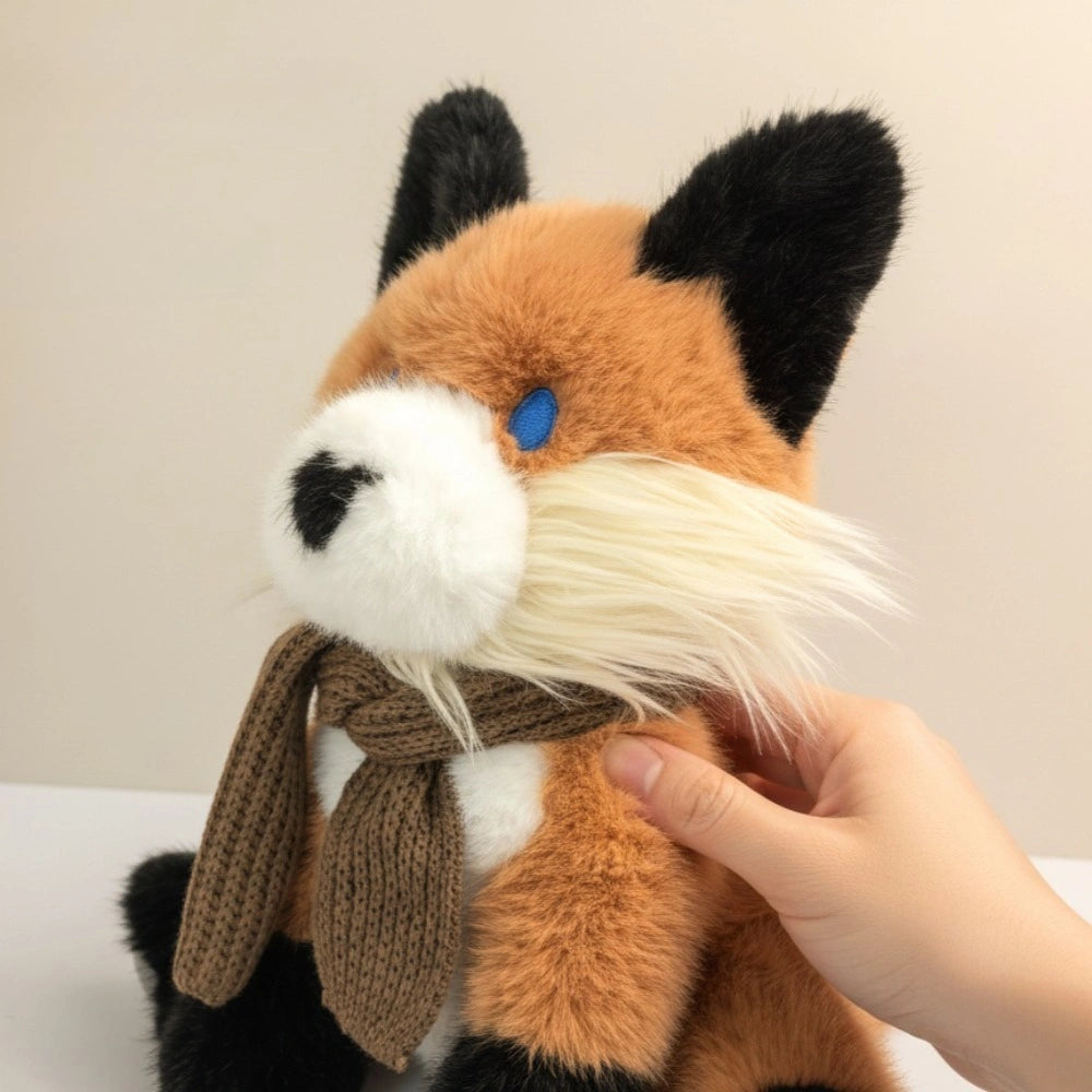 A hand holds the ZoDoll Fox Plush Toy—a 30cm soft red stuffed animal with a brown scarf and blue eyes, ideal for woodland nursery decor—against a plain light background.