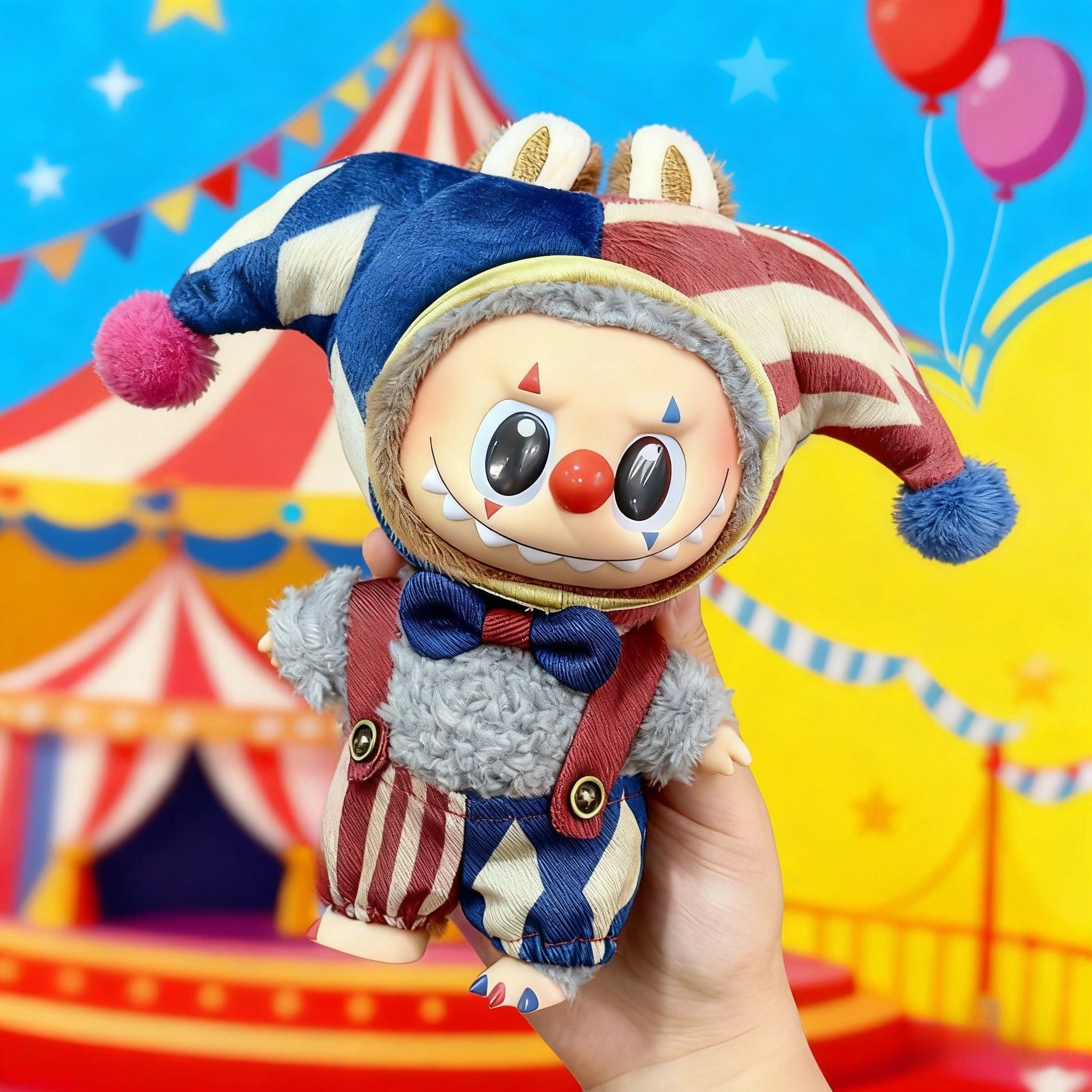 A hand holds the ZoDoll Labubu Jester Clown Doll Costume in a blue-red harlequin circus outfit, featuring a red nose, sharp teeth, and bow tie against a tent and balloons—ideal for Pop Mart collectors.