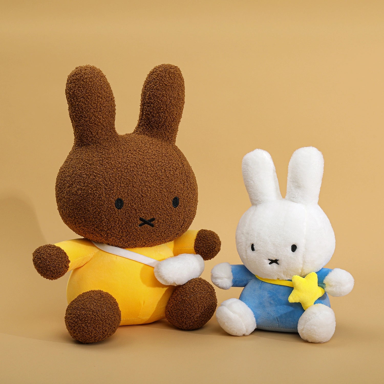 Two ZoDoll Miffy Bunny Plush Dolls (30–80cm) sit side by side: one is brown with a yellow outfit, the other is white in blue with a yellow star.