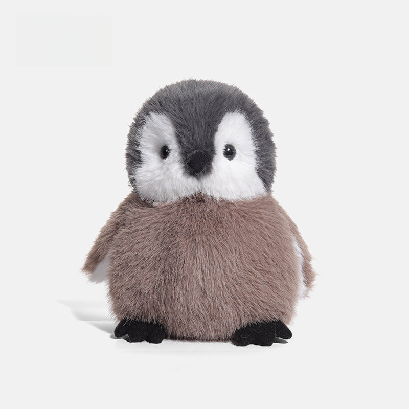 The JOOKI 20cm Baby Penguin Plush Toy features soft grey and white fur, black eyes, and feet—perfect as a cuddly stuffed animal or adorable nursery decor.
