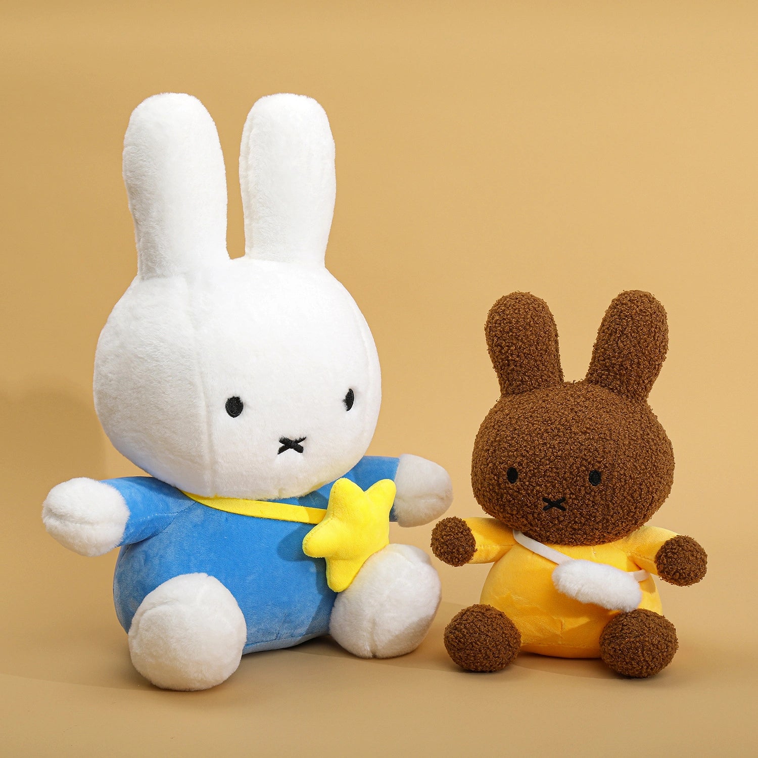 Two ZoDoll Miffy Plush Toys, each 30–80cm, sit side by side: one white bunny wears a blue outfit with a yellow star, and the other brown bunny wears yellow.