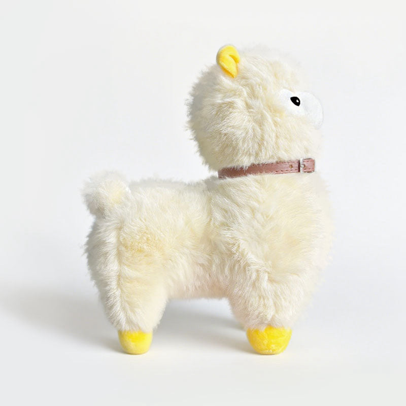The ZoDoll Cute Alpaca Plush Doll is a soft alpaca plush toy with cream fur, yellow feet and ears, and a brown collar, shown against a plain white background.