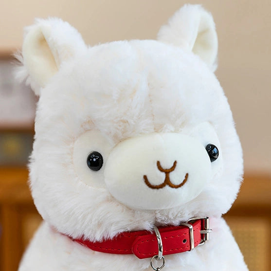 ZoDoll’s Cute Alpaca Plush Toy is a soft stuffed alpaca doll featuring black eyes, a small smile, and a bright red collar—an adorable cuddly companion for any plush lover!.