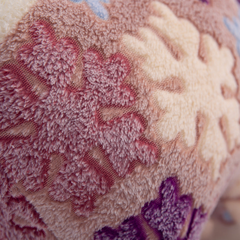 Close-up of ZoDoll's Flower Alpaca Plush Toy, a soft stuffed alpaca doll featuring textured fabric with raised floral patterns in pink, cream, and purple.