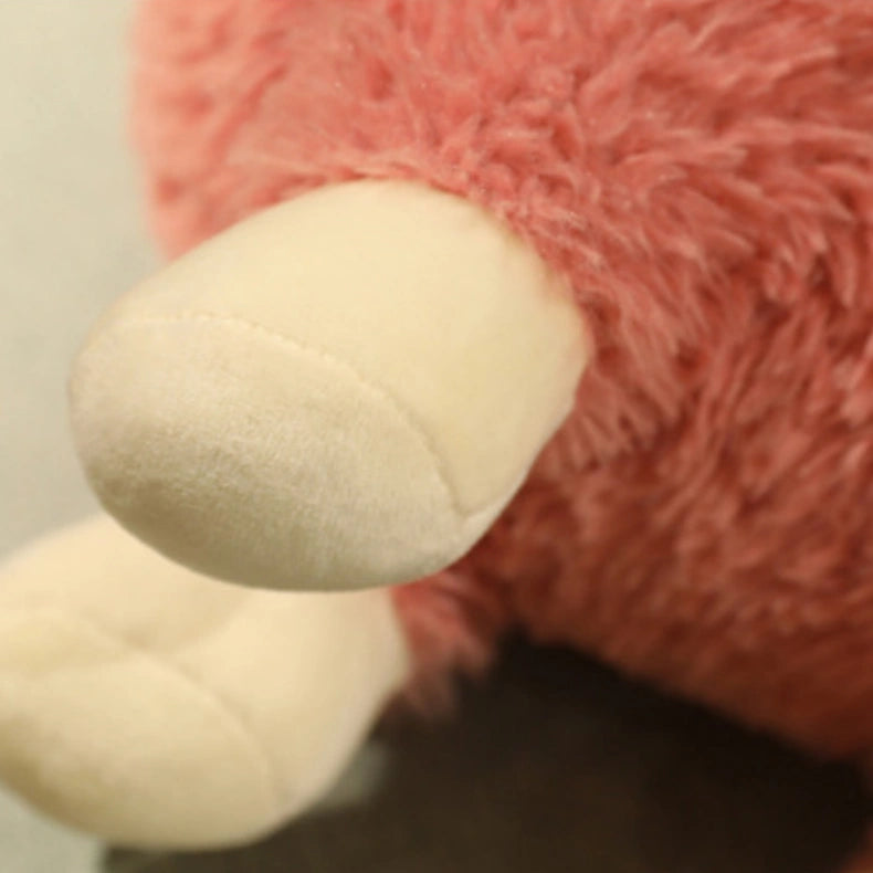 Close-up of the ZoDoll Cute Alpaca Plush Doll, a 26cm soft plush toy with pink fur and two cream-colored, rounded limbs.