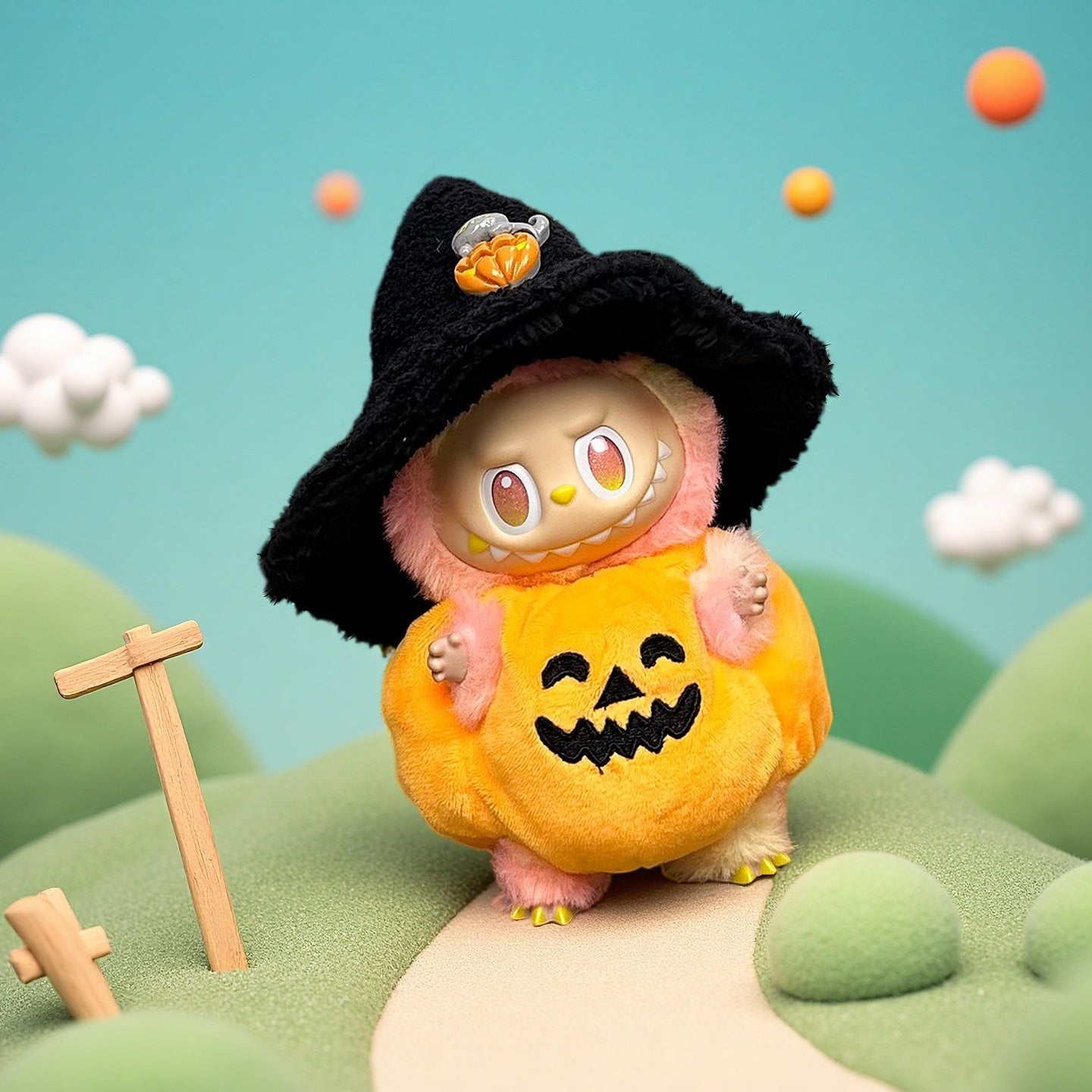 The ZoDoll Labubu Halloween Pumpkin Plush Costume Set with Witch Hat features Labubu in a pumpkin outfit and witch hat, posed on a mini landscape with winding paths and stylized clouds.