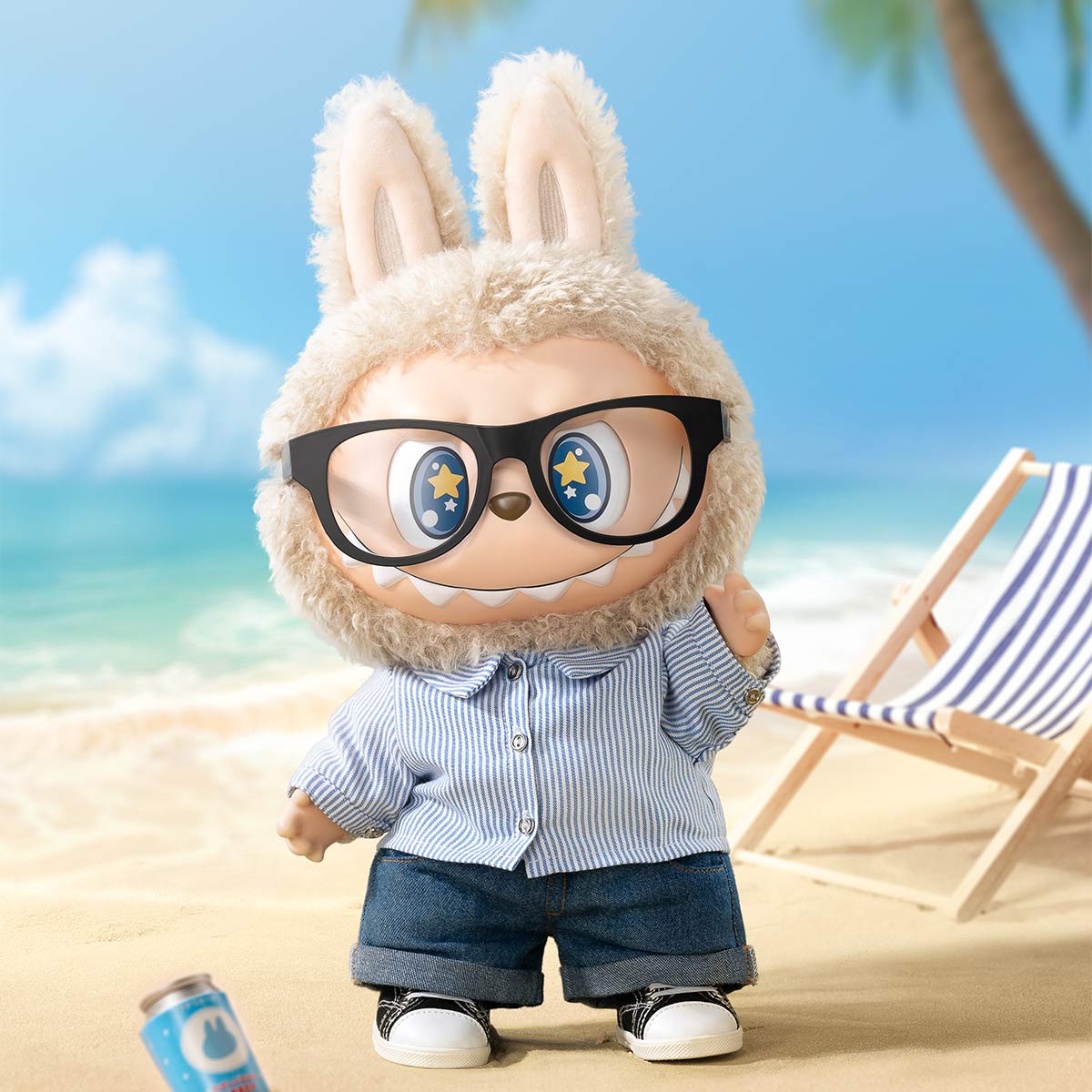 POP MART’s THE MONSTERS – FLIP WITH ME 38cm Labubu Vinyl Plush Doll in a sailor shirt and denim stands on a sandy beach with a deck chair and palm tree—ideal for collectible fashion art fans.